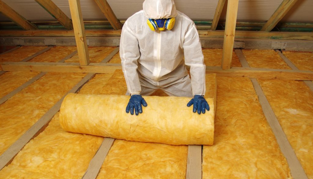 Construction,Worker,Thermally,Insulating,House,Attic,With,Glass,Wool