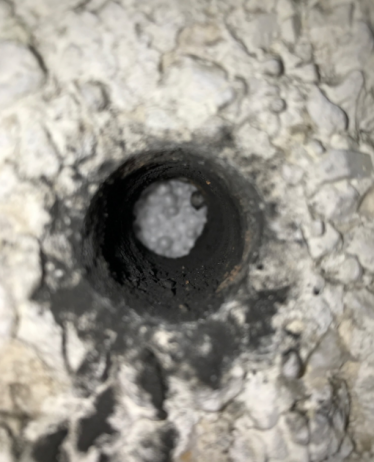 Filled drill hole